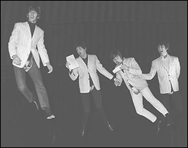 The Beatles take flight.