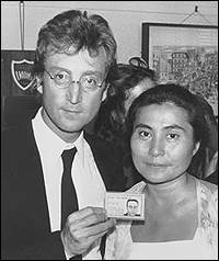 John Lennon poses with wife, Yoko Ono, on the day he finally got his green card.