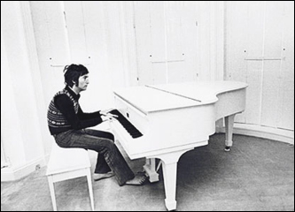 John Lennon at the Imagine piano in the Tittenhurst mansion.