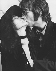 John Lennon kisses Yoko Ono in a photo session from the early 1970s.