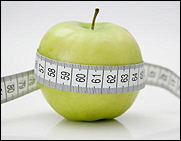 Tape measure on an apple.
